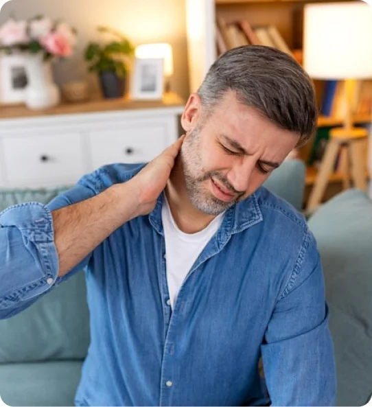 Man holding his painful neck