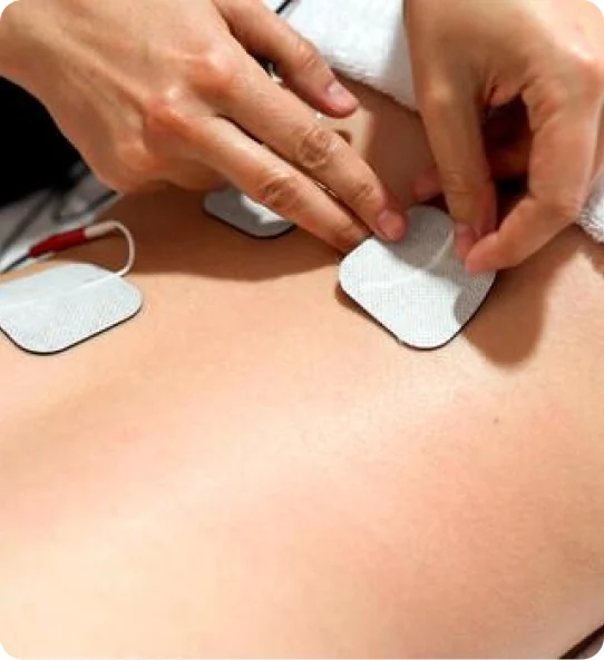 Electro-therapy pads placed on a patient's back